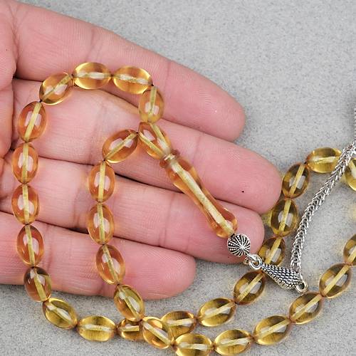 Ate� Kehribar Alpaka P�sk�ll� Beyzi Kesim 7x11mm Tesbih- �effaf Sar�