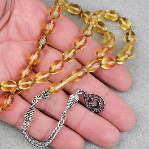 Ate� Kehribar Alpaka P�sk�ll� Beyzi Kesim 7x11mm Tesbih- �effaf Sar�