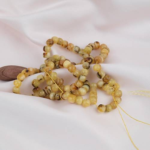 Damla Kehribar 99luk Tekerlek Kesim 7x5mm Namez Tesbihi