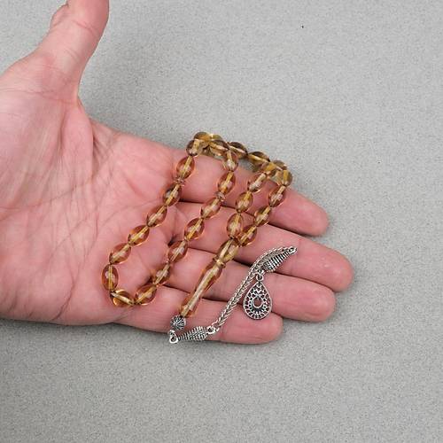 Ate� Kehribar Alpaka P�sk�ll� Beyzi Kesim 7x11mm Tesbih- A��k Sar�