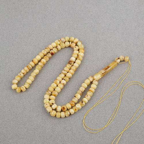 Damla Kehribar 99luk Tekerlek Kesim 7x5.5mm Namez Tesbihi