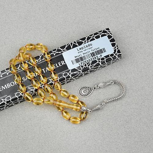 Ate� Kehribar Alpaka P�sk�ll� Beyzi Kesim 7x11mm Tesbih- �effaf Sar�