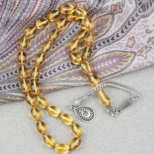 Ate� Kehribar Alpaka P�sk�ll� Beyzi Kesim 7x11mm Tesbih- �effaf Sar�