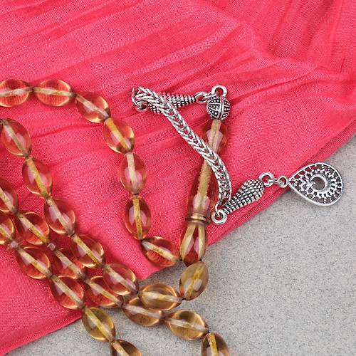 Ate� Kehribar Alpaka P�sk�ll� Beyzi Kesim 7x11mm Tesbih- A��k Sar�