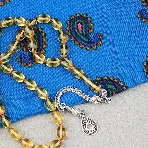 Ate� Kehribar Alpaka P�sk�ll� Beyzi Kesim 7x11mm Tesbih- �effaf Sar�