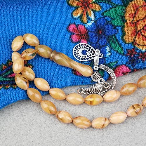 S�kma Kehribar Alpaka P�sk�ll� Beyzi Kesim 7x11mm Tesbih- Krem Sar�